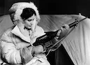 How can a  young lady protect you in case of a polar bear attack? 

The photos shows KLM flight attendant Joanna Van Duffelen, with a Fairchild Armalite AR–10 combat rifl
