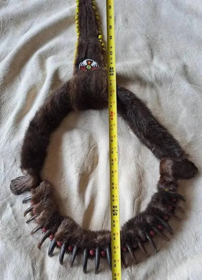 What do you all think? Grizzly claws with otter fur and vintage glass beads. Made from recycled old taxidermy.