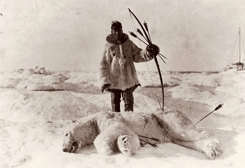 An Inuit hunter stands over a dead polar bear. November 26, 1924, USA
The Inuit are an ethnic group of indigenous peoples of North America living in the vast northern te